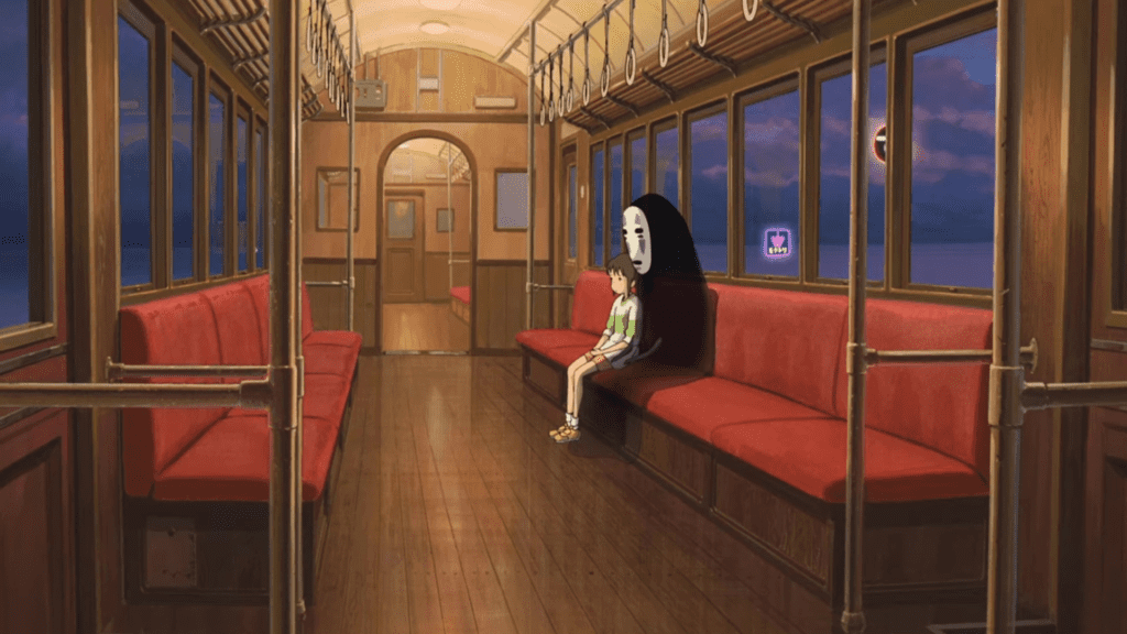 Chihiro e Sem Face no trem em A Viagem de Chihiro.